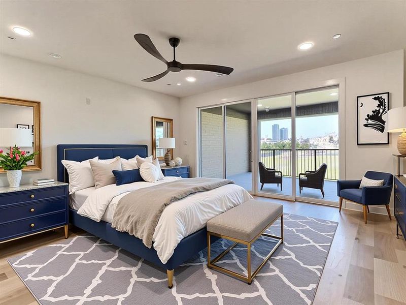 Primary bedroom with balcony riverfront and skyline view.