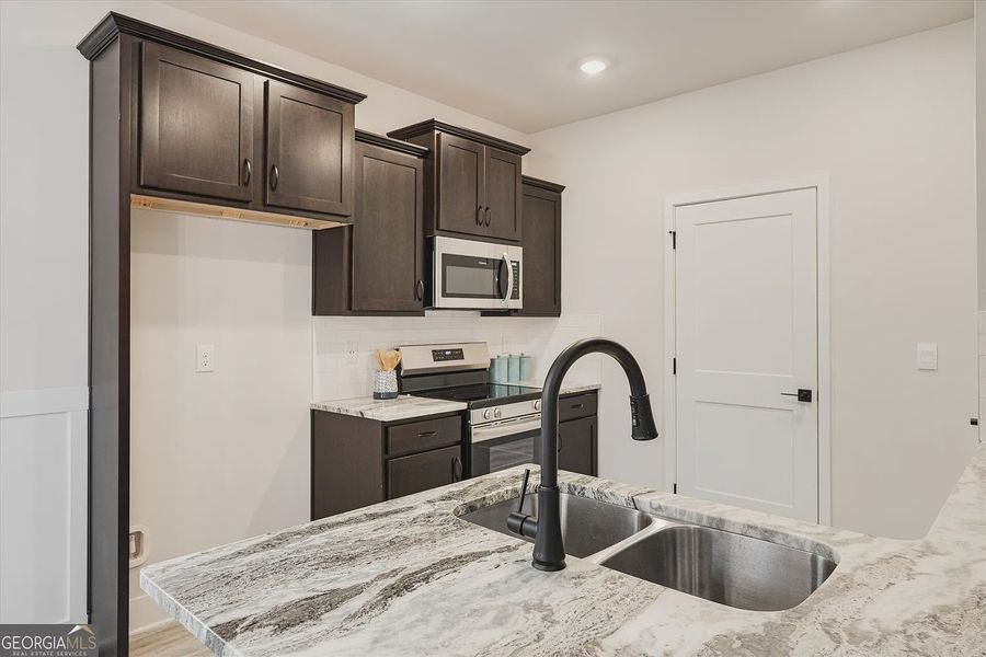 Furnished interior view inside a new home in Canterbury Villas, Carrollton (Image 15).