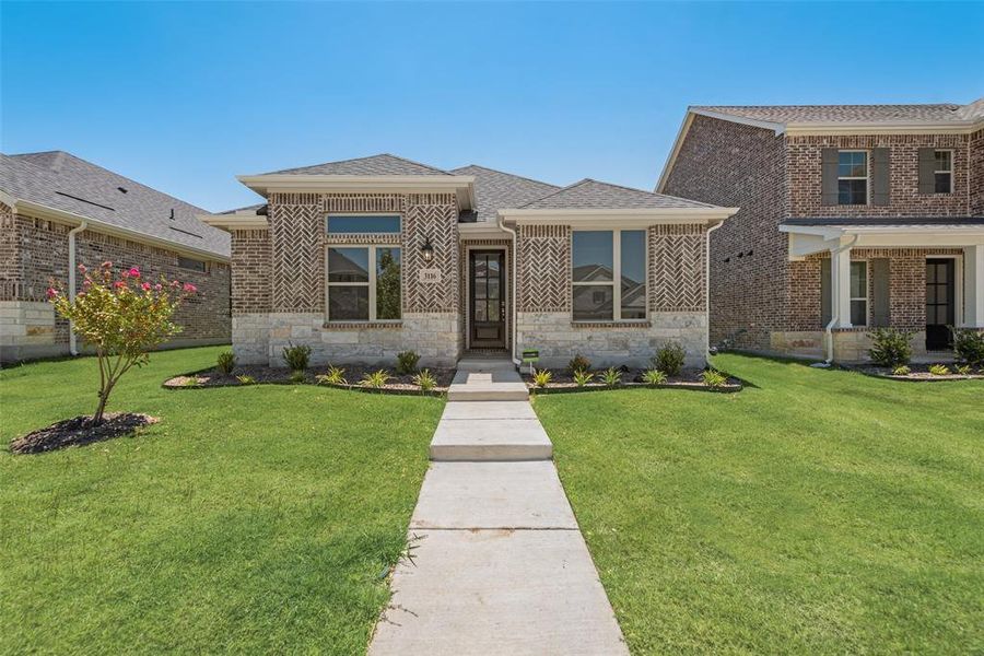 Front exterior of a new home in Arbors at Legacy Hills, Celina, TX, highlighting curb appeal (Image 17). Front exterior of a new home in Arbors at Legacy Hills, Celina, TX, highlighting curb appeal (Image 17).