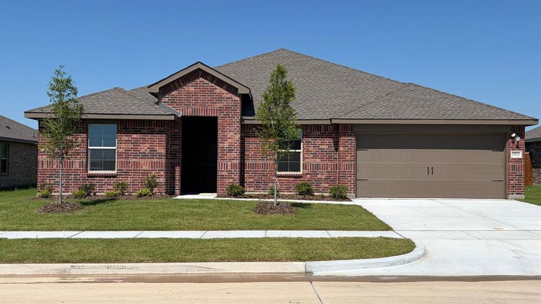 Brick exterior with a dark brown garage door and a concrete driveway Brick exterior with a dark brown garage door and a concrete driveway