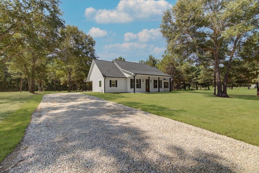Front exterior of a new home in , Dayton, TX, highlighting curb appeal (Image 22). Front exterior of a new home in , Dayton, TX, highlighting curb appeal (Image 22).