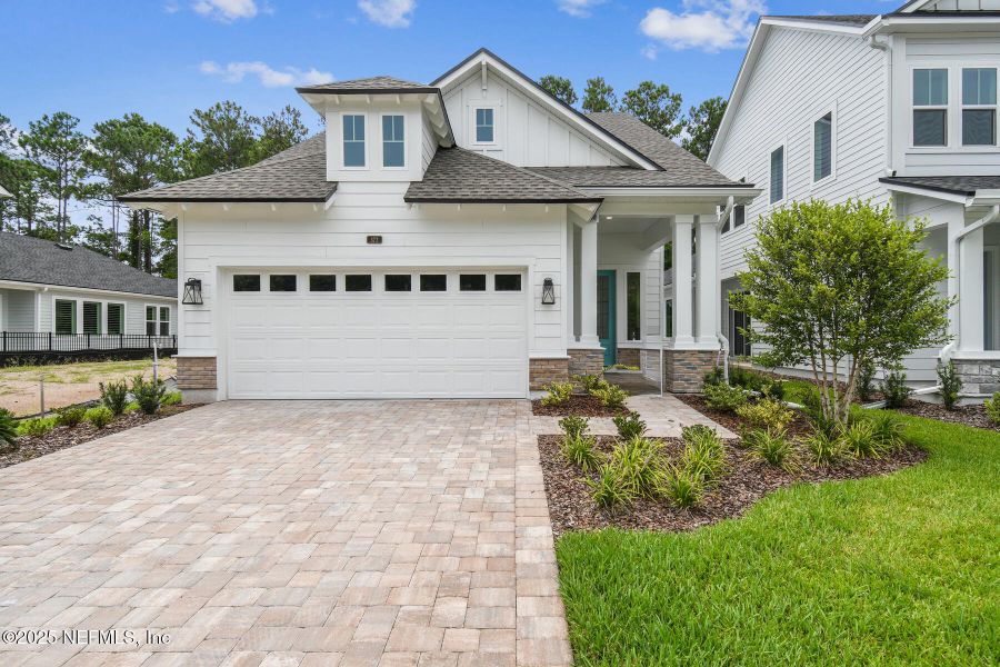Front exterior of a new home in Reflections 40' Front Load, Ponte Vedra, FL, highlighting curb appeal (Image 2).