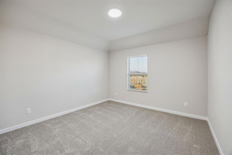 Bedroom in the Wimbledon home plan by Trophy Signature Homes – REPRESENTATIVE PHOTO