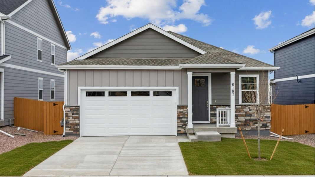Front exterior of a new home in Silver Peaks, Lochbuie, CO, highlighting curb appeal (Image 1). Front exterior of a new home in Silver Peaks, Lochbuie, CO, highlighting curb appeal (Image 1).