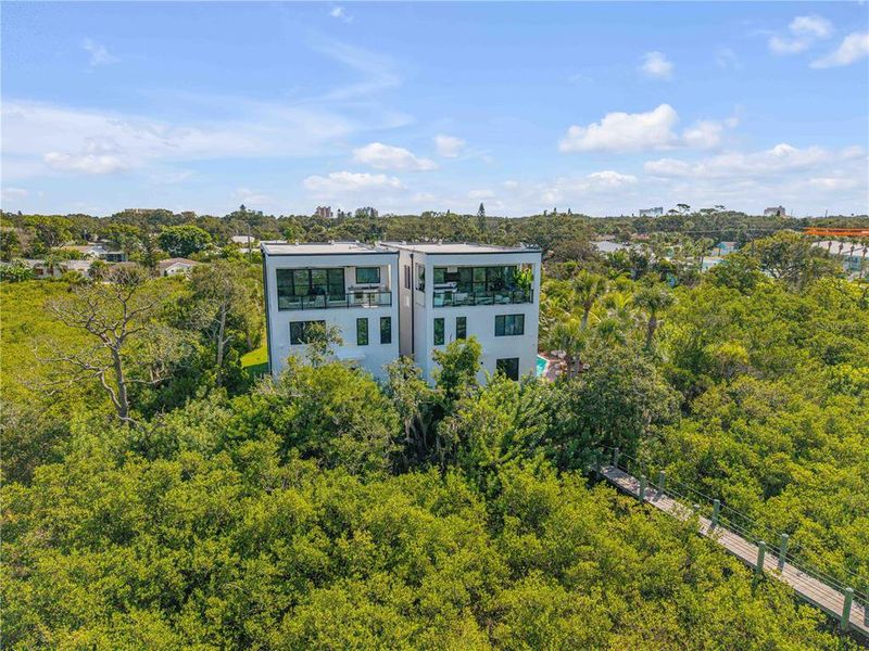 Front exterior of a new home in , New Smyrna Beach, FL, highlighting curb appeal (Image 2). Front exterior of a new home in , New Smyrna Beach, FL, highlighting curb appeal (Image 2).