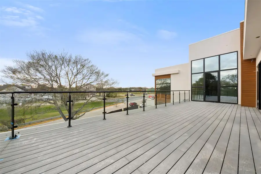 Balcony off the west side of the home parallel to Rice Blvd, with access from the 2nd floor landing and back secondary bedroom.