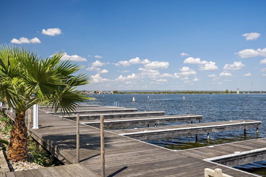 Boasting a private dock system with unobstructed lake access, perfect for aquatic adventures.