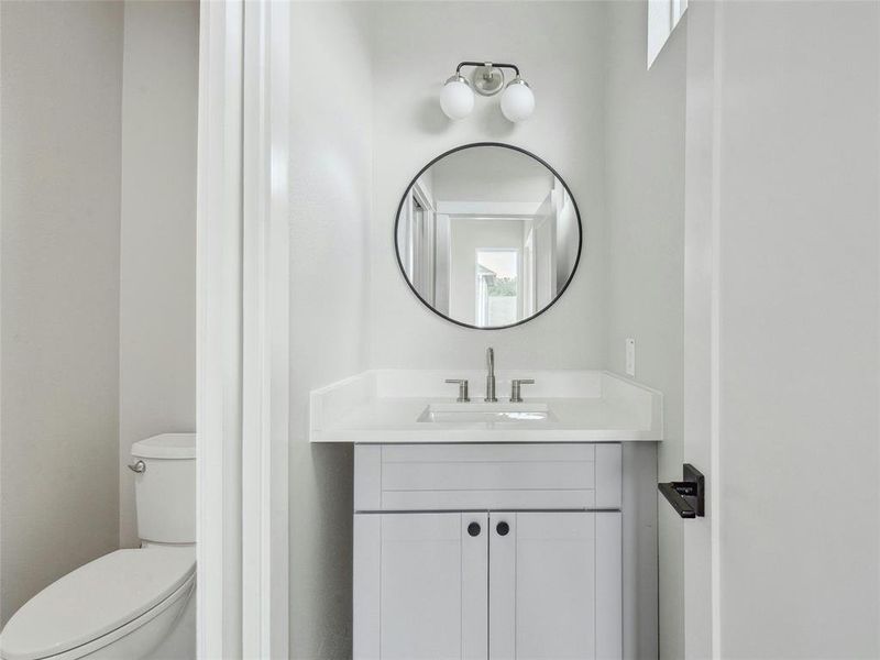 The guest bathroom is a stylish sanctuary featuring modern fixtures and tasteful finishes, providing a welcoming space for visitors to freshen up and unwind.