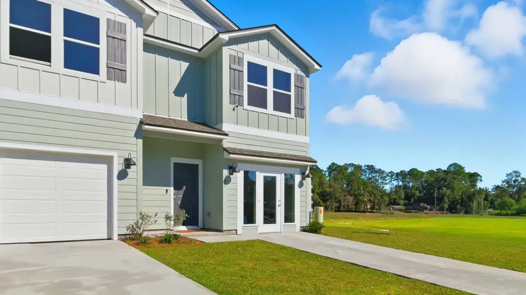 Front exterior of a new home in Abilene Acres, Tallahassee, FL, highlighting curb appeal (Image 26).