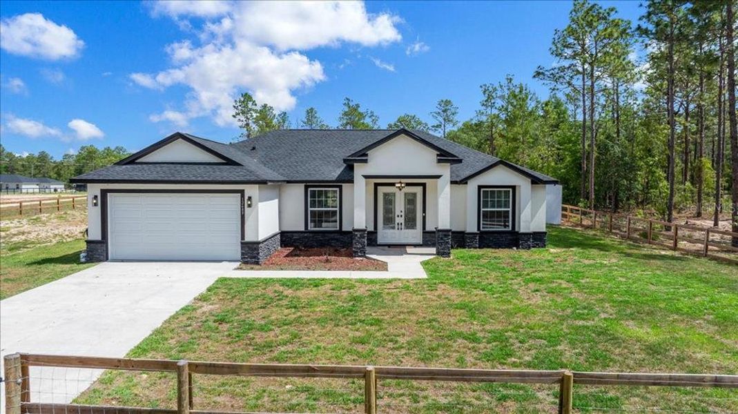 Front exterior of a new home in , Dunnellon, FL, highlighting curb appeal (Image 2). Front exterior of a new home in , Dunnellon, FL, highlighting curb appeal (Image 2).