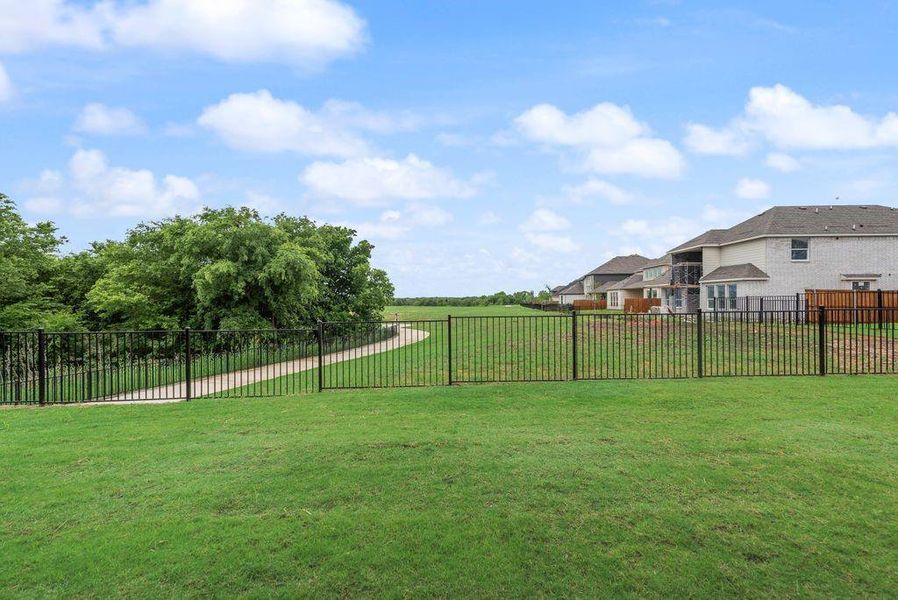 Exterior details and patio area of a home in Valencia On The Lake, Little Elm (Image 23).