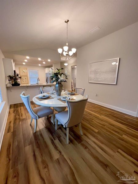 Representative furnished interior of a home built from the Plan 1454 by Adams Homes in Westpointe Place, Pensacola (Image 5).