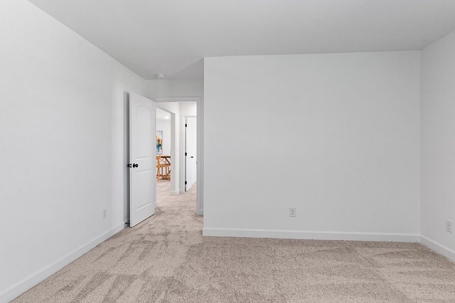 A hallway with white walls.