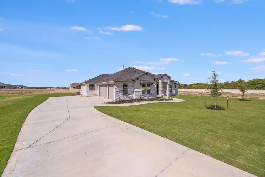 Representative exterior photo of a completed home built from the Llano II by Giddens Homes in Whispering Wind, Bertram, TX (Image 35). Representative exterior photo of a completed home built from the Llano II by Giddens Homes in Whispering Wind, Bertram, TX (Image 35).
