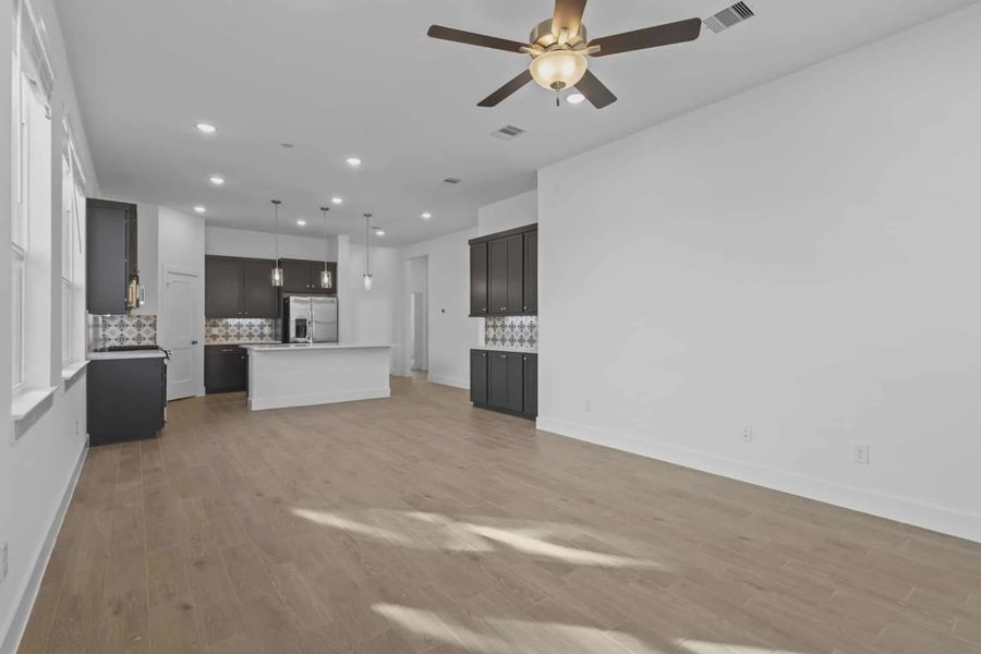 Representative unfurnished interior of a home built from the Athens by Chesmar Homes in Sunterra, Katy (Image 17).