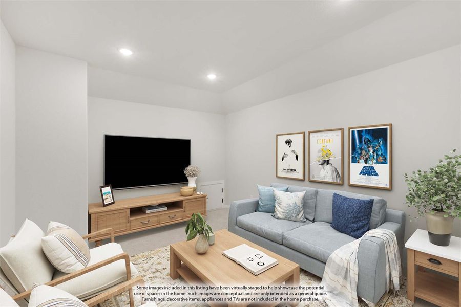 Living room with gray sofa, wall-mounted TV, wood media console, and framed movie posters on white walls