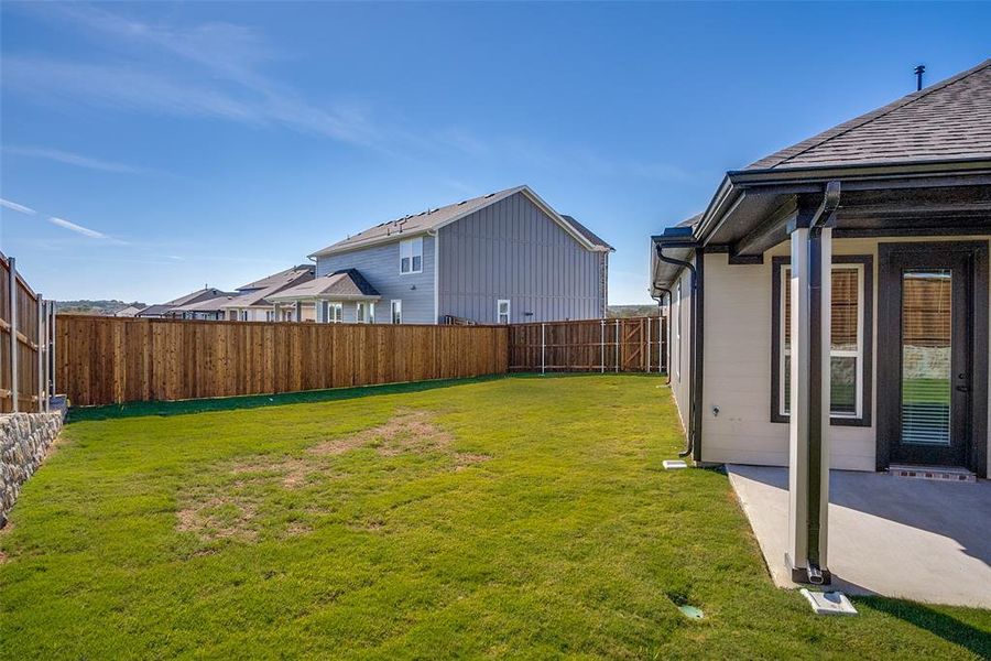 Exterior details and patio area of a home in Sierra Vista at Kelly Ranch, Aledo (Image 3).