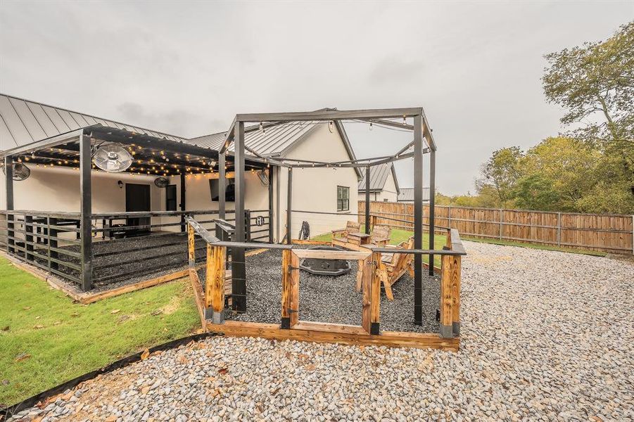 View of yard with a gazebo and a fire pit View of yard with a gazebo and a fire pit