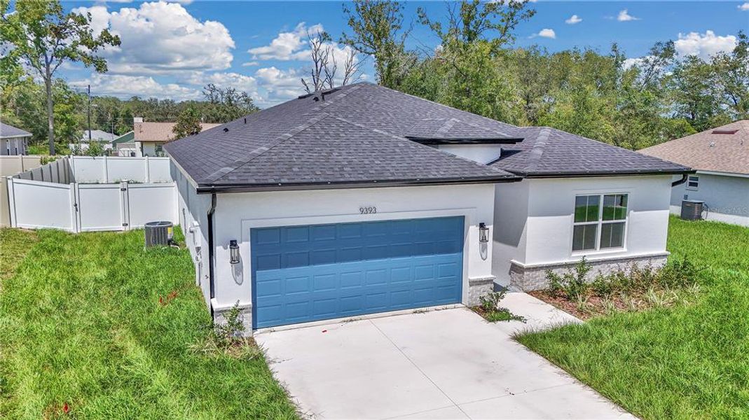 Front exterior of a new home in , Summerfield, FL, highlighting curb appeal (Image 25).