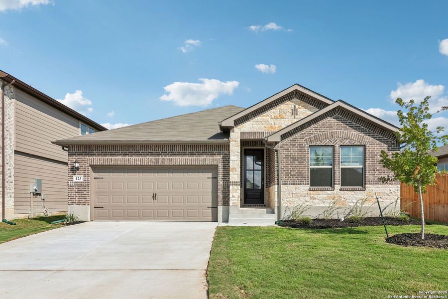 Front exterior of a new home in Legendary Trails - Classic Series, Cibolo, TX, highlighting curb appeal (Image 2). Front exterior of a new home in Legendary Trails - Classic Series, Cibolo, TX, highlighting curb appeal (Image 2).