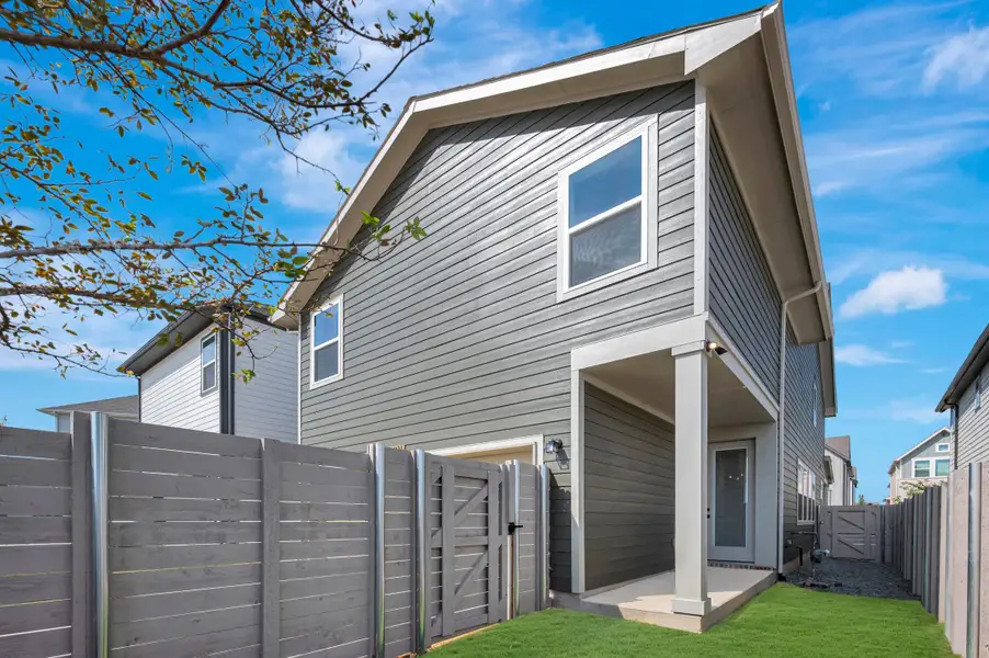 Exterior details and patio area of a home in Painted Tree Woodland West – Cottages, McKinney (Image 3).