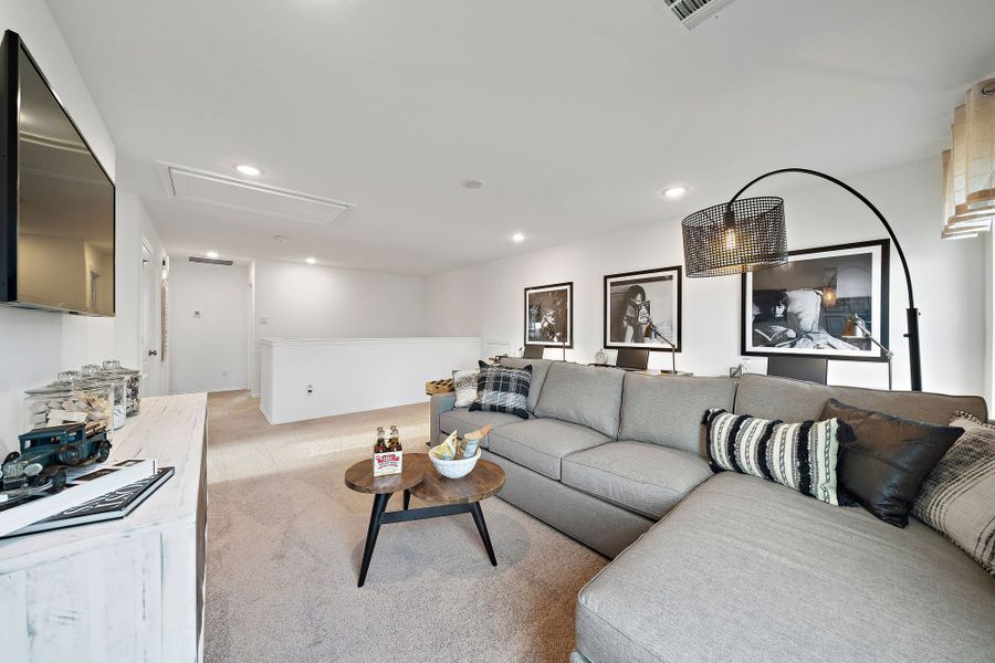 A living room with a couch and a table.