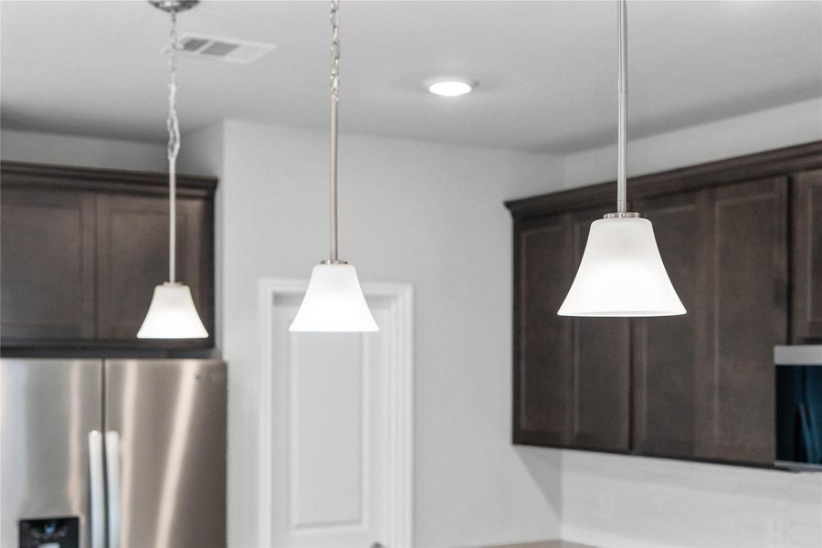 Style Pendants Brushed Nickel lights that hang over the kitchen island.