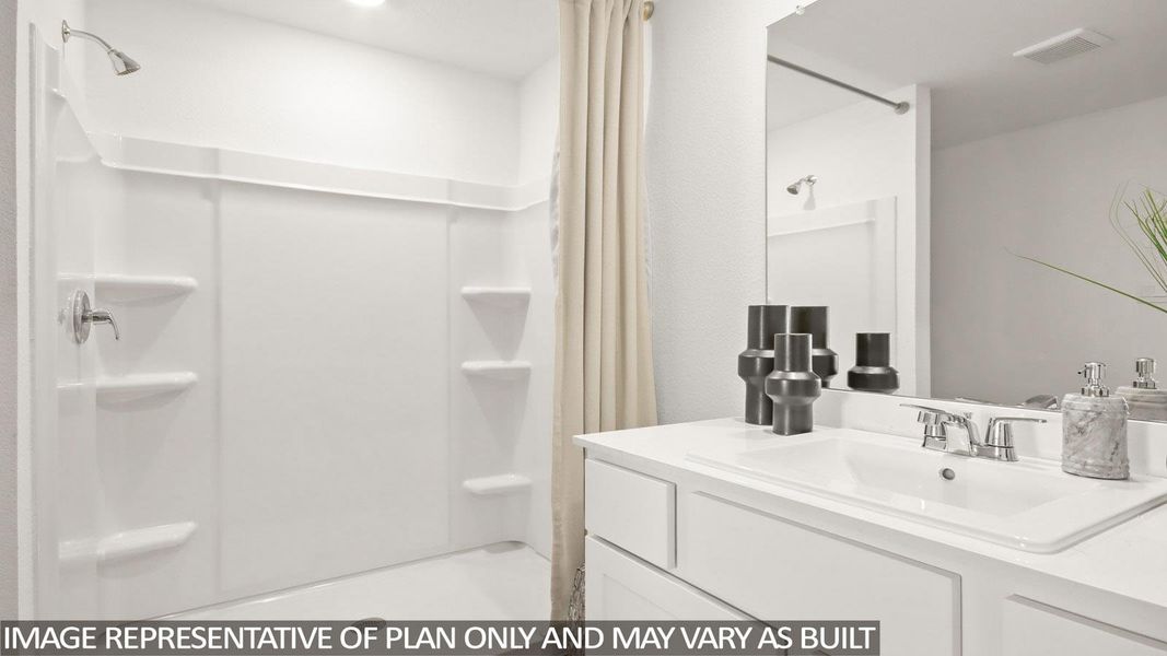 Bathroom with vanity and a shower stall