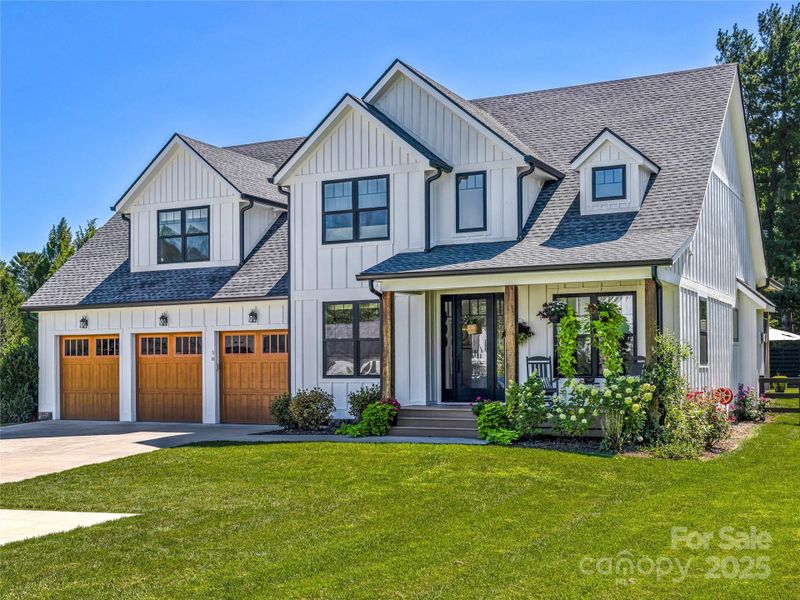 Front exterior of a new home in , Mills River, NC, highlighting curb appeal (Image 21).