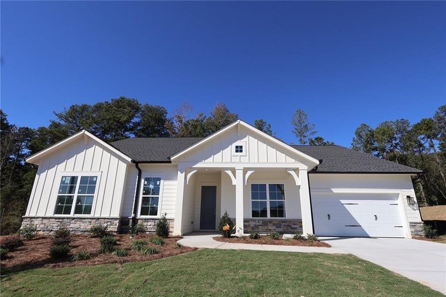 Front exterior of a new home in Old Mill Preserve, Dallas, GA, highlighting curb appeal (Image 1). Front exterior of a new home in Old Mill Preserve, Dallas, GA, highlighting curb appeal (Image 1).