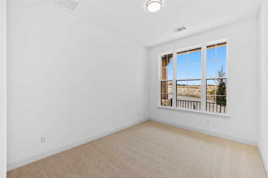 Unfurnished room with light carpet and baseboards