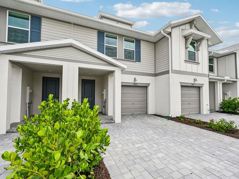 Front exterior of a new home in Meritage Homes at Central Park, Port St. Lucie, FL, highlighting curb appeal (Image 2). Front exterior of a new home in Meritage Homes at Central Park, Port St. Lucie, FL, highlighting curb appeal (Image 2).