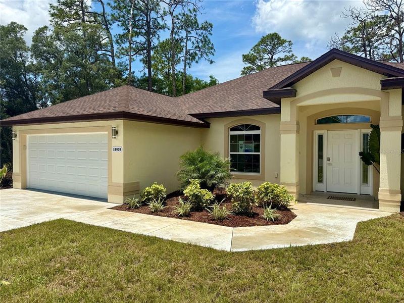 Front exterior of a new home in , Dunnellon, FL, highlighting curb appeal (Image 27).