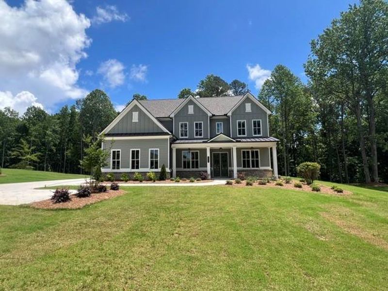 Front exterior of a new home in , Cumming, GA, highlighting curb appeal (Image 2). Front exterior of a new home in , Cumming, GA, highlighting curb appeal (Image 2).