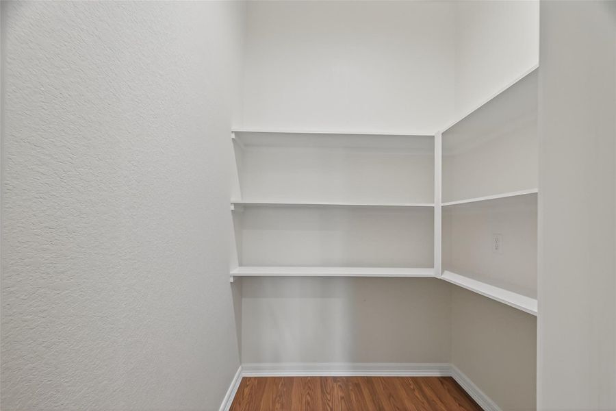 LARGE WALK IN PANTRY WITH OUTLETS AND INSTALLED SHELFS. OPEN HOUSE THIS SUNDAY 1-3PM