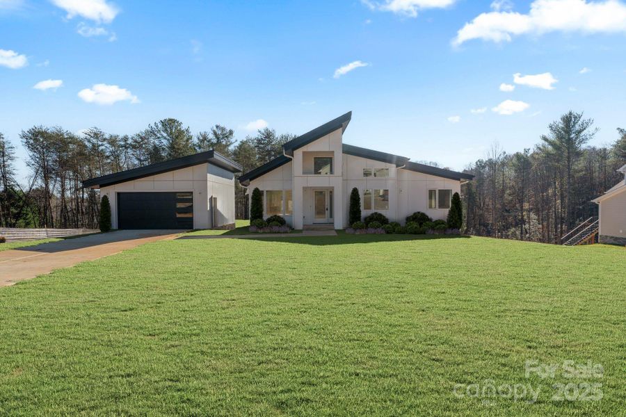 Front exterior of a new home in , Hickory, NC, highlighting curb appeal (Image 1).