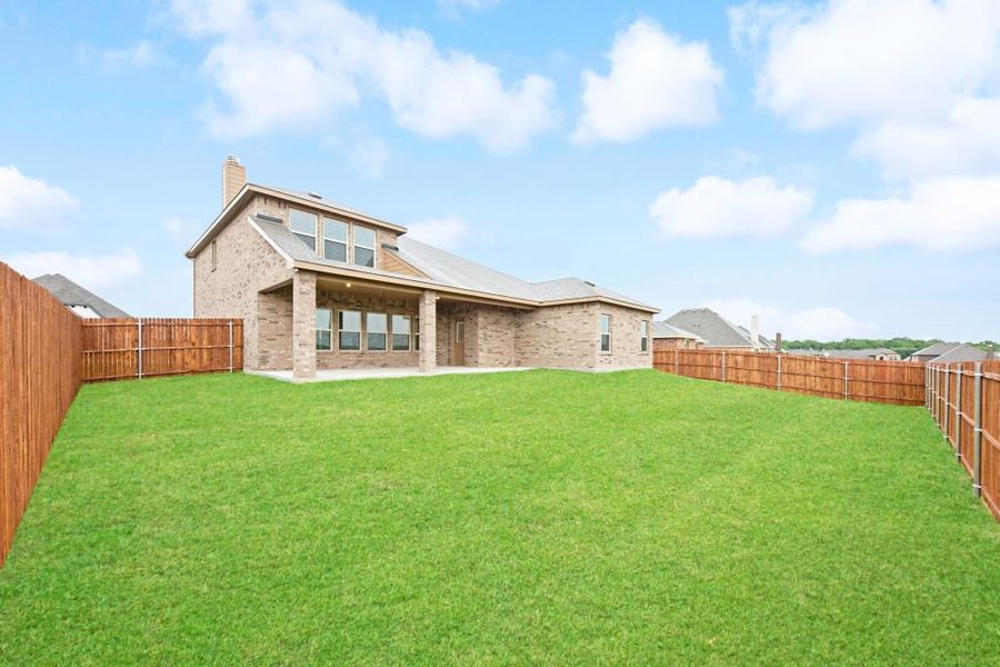 Representative exterior photo of a completed home built from the Radcliffe II by Impression Homes in Stone Eagle, Azle, TX (Image 27).
