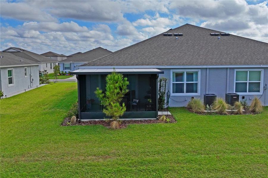 Exterior details and patio area of a home in Towns at Woodsdale, Wesley Chapel (Image 24).
