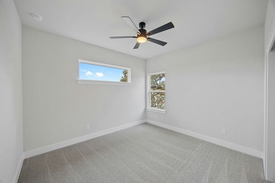 Spacious, unfurnished interior of a new home in Caliterra, Dripping Springs (Image 32).