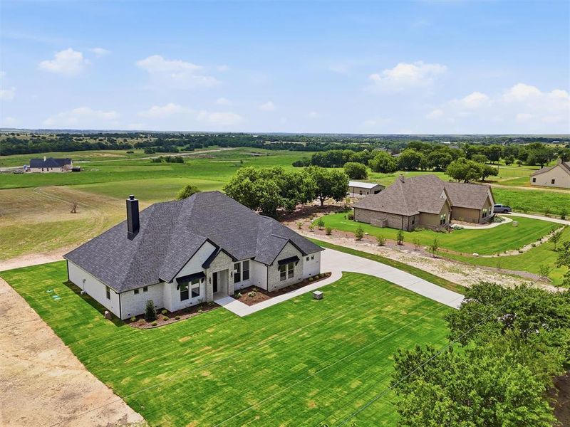 Front exterior of a new home in , Godley, TX, highlighting curb appeal (Image 20). Front exterior of a new home in , Godley, TX, highlighting curb appeal (Image 20).