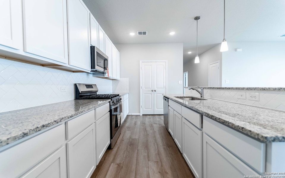 Furnished interior view inside a new home in Hennersby Hollow, San Antonio (Image 2). Furnished interior view inside a new home in Hennersby Hollow, San Antonio (Image 2).