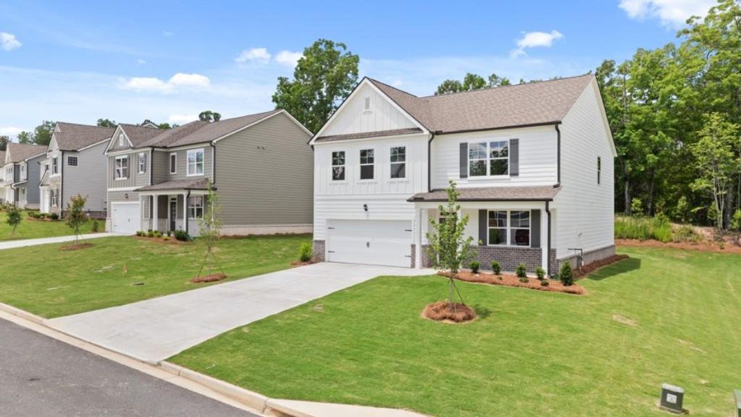 Front exterior of a new home in Parkside at Carter Grove, Cartersville, GA, highlighting curb appeal (Image 2). Front exterior of a new home in Parkside at Carter Grove, Cartersville, GA, highlighting curb appeal (Image 2).