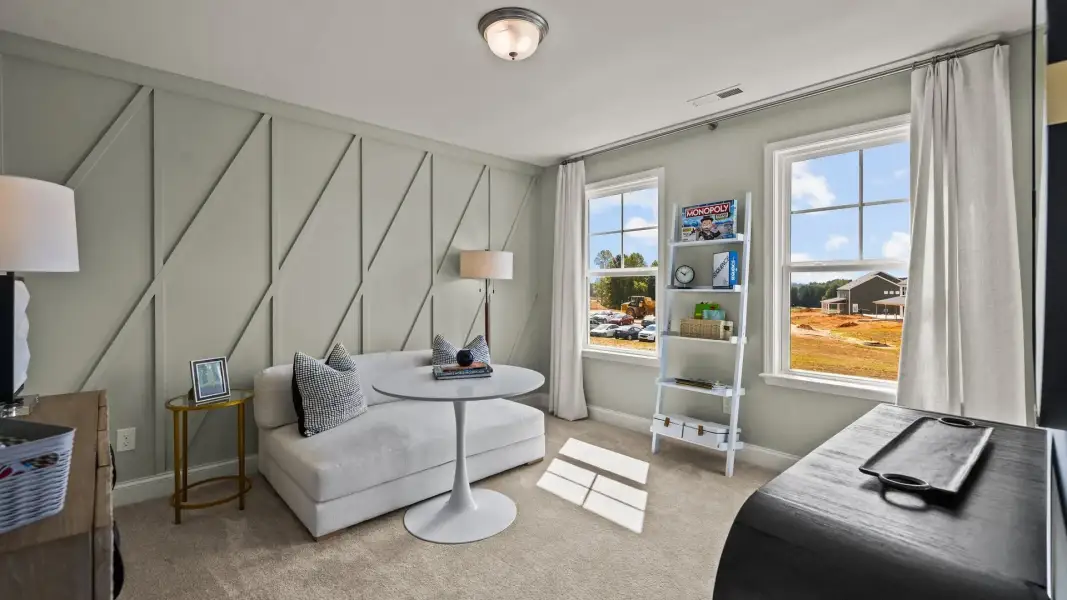 Flexible bedroom with elevated ceiling, large windows, and premium finishes, in the Townsend Design by DRB Homes in York, SC Flexible bedroom with elevated ceiling, large windows, and premium finishes, in the Townsend Design by DRB Homes in York, SC