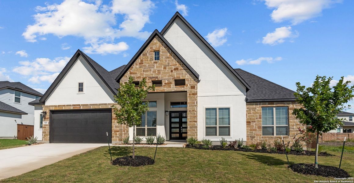 Front exterior of a new home in Mesa Western, Cibolo, TX, highlighting curb appeal (Image 21). Front exterior of a new home in Mesa Western, Cibolo, TX, highlighting curb appeal (Image 21).