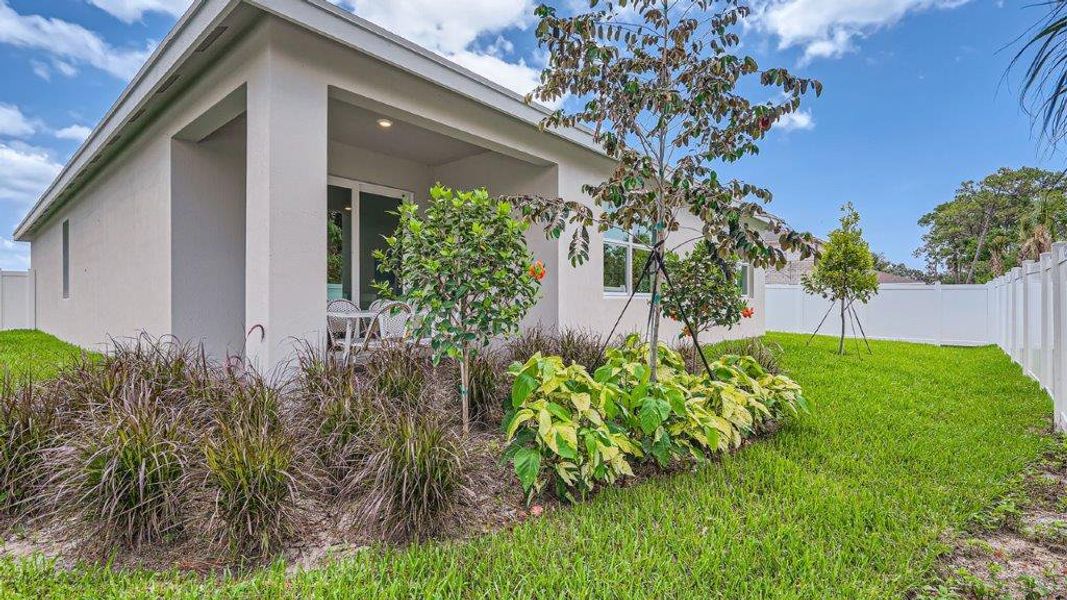 Exterior details and patio area of a home in Sandpiper Square, Stuart (Image 20).