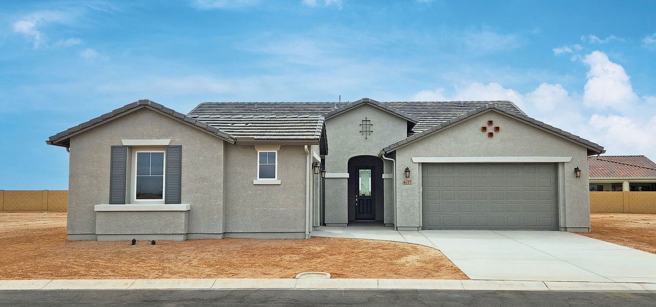 Front exterior of a new home in Robson Ranch Arizona, Eloy, AZ, highlighting curb appeal (Image 1). Front exterior of a new home in Robson Ranch Arizona, Eloy, AZ, highlighting curb appeal (Image 1).