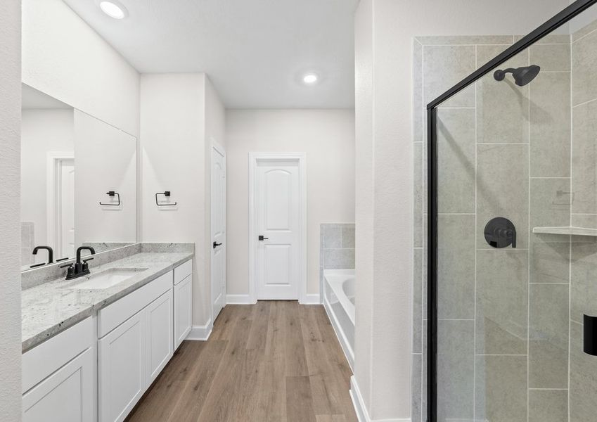 The master bathroom of the Cypress has a large walk-in shower and garden tub.