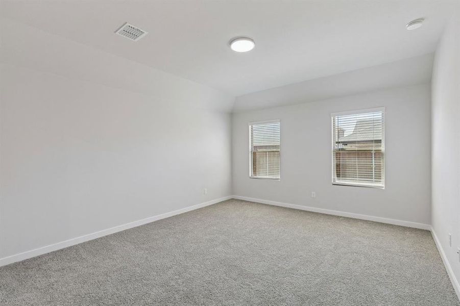 Primary Suite in the Harrison home plan by Trophy Signature Homes – REPRESENTATIVE PHOTO