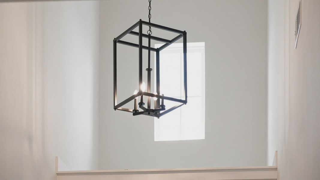 Closeup of entry way hanging light design.