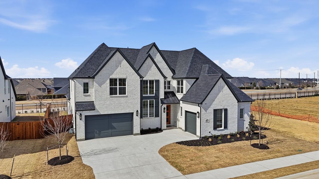 Front exterior of a new home in Park Place - 80' Lots, Prosper, TX, highlighting curb appeal (Image 20). Front exterior of a new home in Park Place - 80' Lots, Prosper, TX, highlighting curb appeal (Image 20).